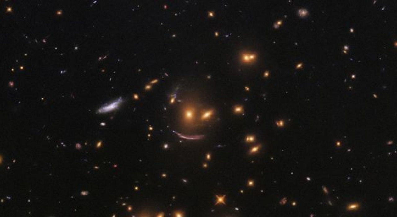 Hubble Space Telescope Snaps Smiley-Shaped Cluster of Galaxies